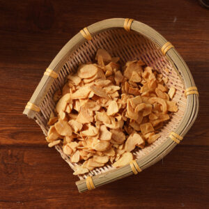 Golden crispy fried garlic chips close-up detail