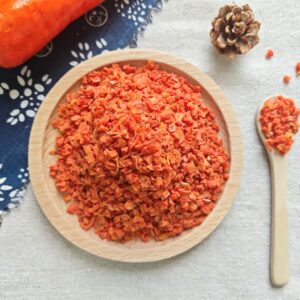 dehydrated carrot granules bright orange color close up