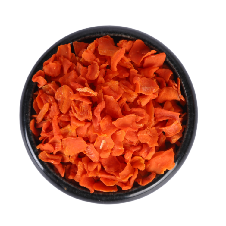 Close-up of air dried dehydrated carrot flakes showing uniform flake size and clean texture
