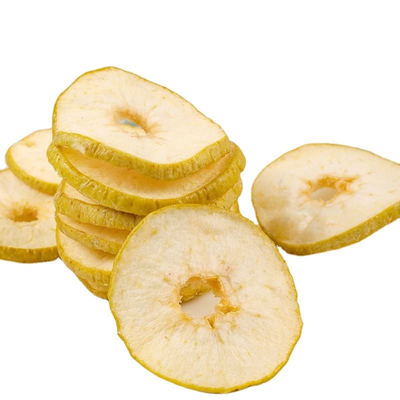 Vacuum fried green apple slices overview, cream flesh with vivid green skin edge