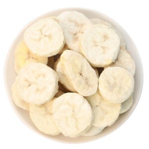 Freeze dried banana slices overview, light golden round slices in coin shape