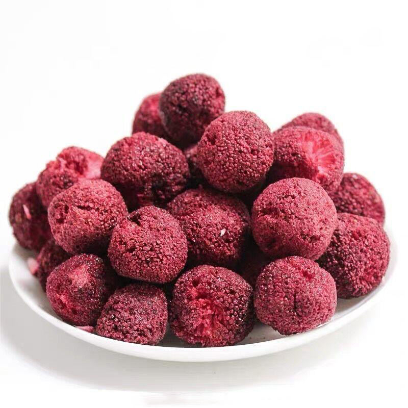 Freeze dried bayberry pile display, abundant whole berries in rich red purple color